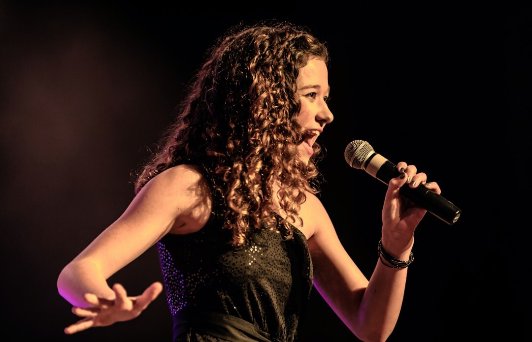 young female singer performing on stage